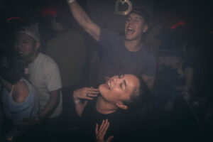 Guests dancing under club lights in Seoul