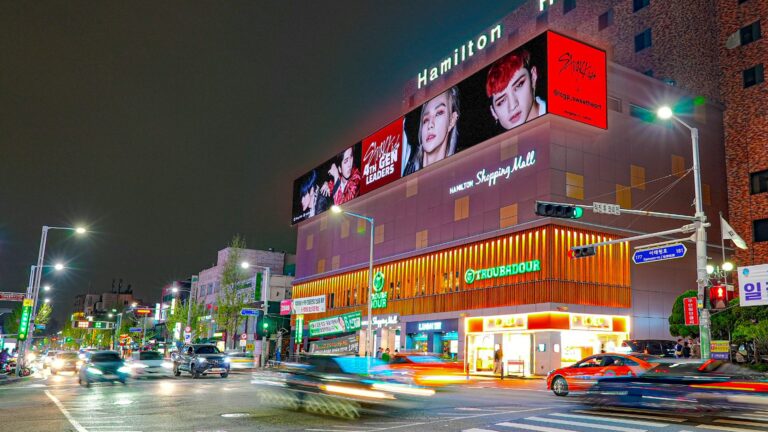 Iconic view of Itaewon’s main street with the Hamilton Hotel prominently displayed, surrounded by vibrant neon signs and showcasing the district’s recognisable skyline.