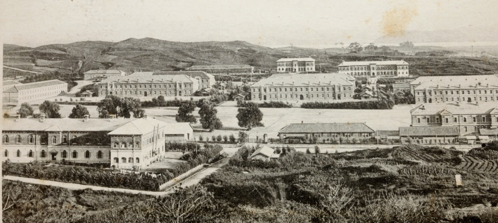 The view from the early years of the Japanese occupation of U.S. Army Garrison Yongsan: view from the north of the 78th Infantry Regiment Barracks in distance (Eighth Army-Korea Headquarters in center; 1st Signal Brigade building on right); drill field (now known as Knight Field) in center.