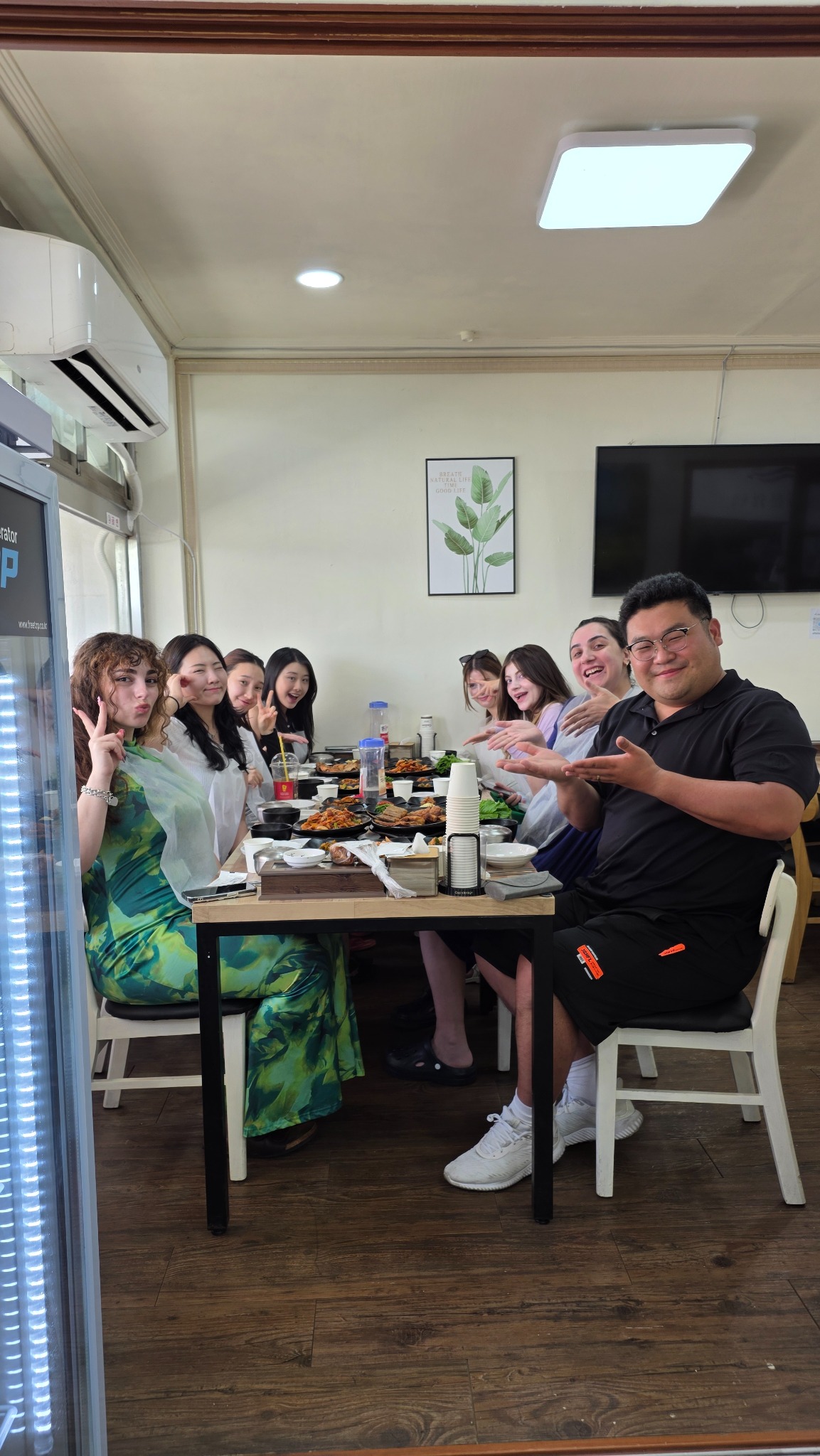 A small Seoul Night Life group seated around a Korean dining table