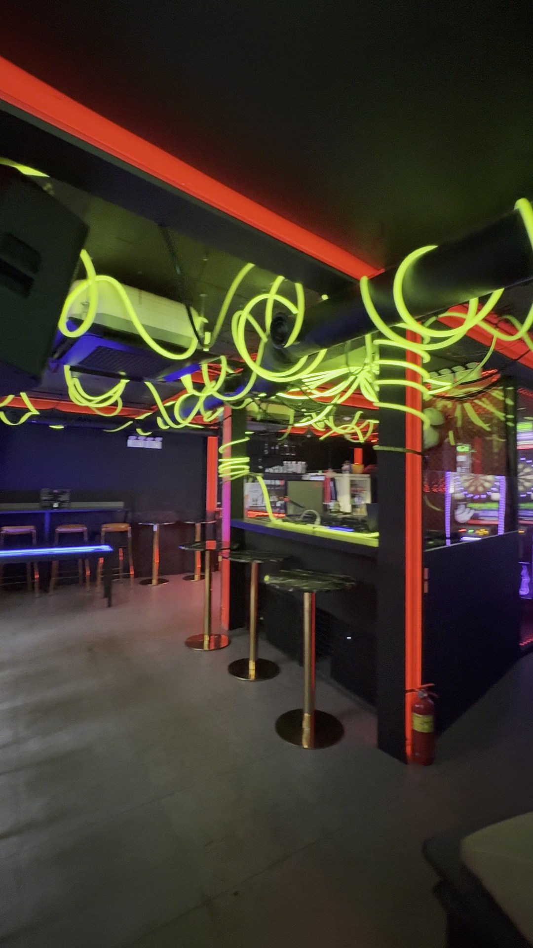 Green lighting and seating inside MOLA by Molecula in Itaewon