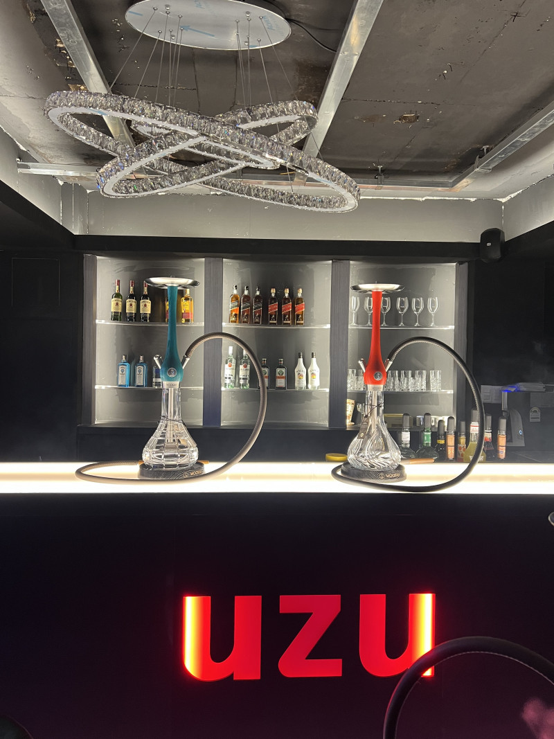 Illuminated UZU bar counter and chandelier inside UZU Itaewon